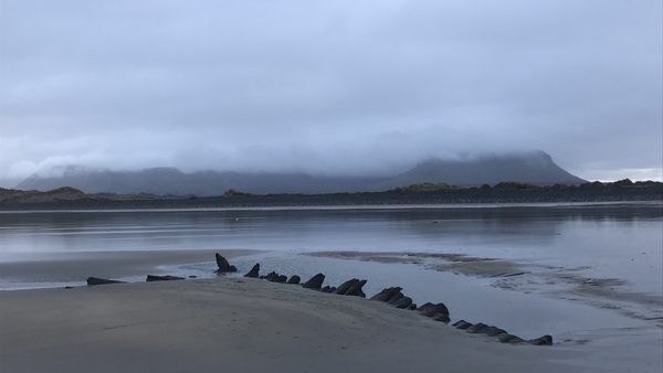 The remains of the wreck are revealed at low tide on Streedagh beach