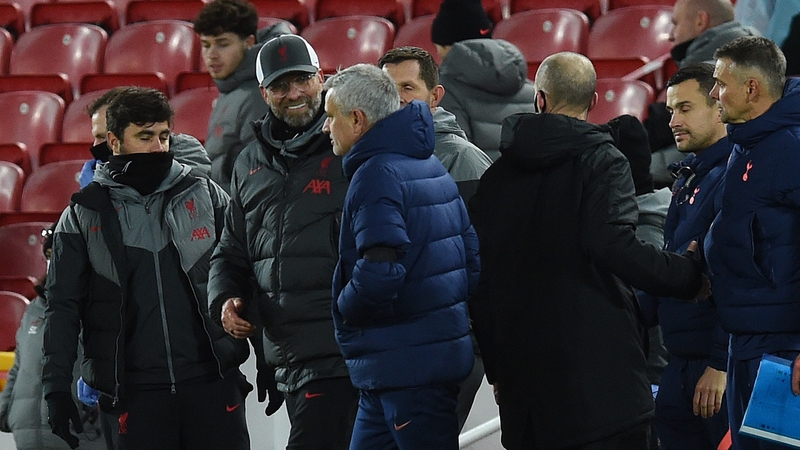 A beaming Jurgen Klopp and a crestfallen Jose Mourinho interact at full-time