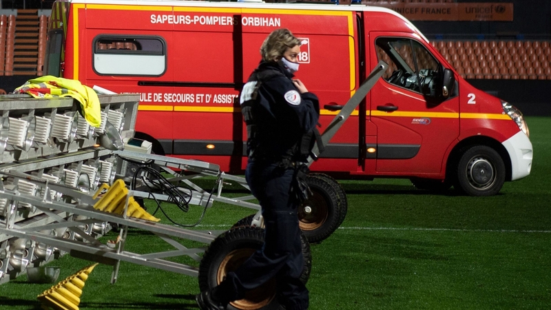 Members of the medical staff and firemen at the scene of the accident