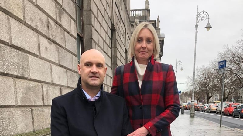 Former golfer Ian St John and his wife Orla outside the High Court