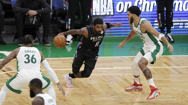 Kyrie Irving of the Brooklyn Nets drives to the basket during the first quarter of the game against the Boston Celtics at TD Garden