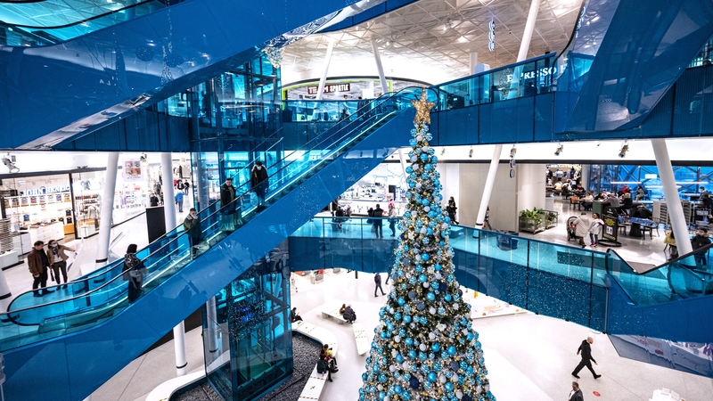 Shoppers maintain social distancing on escalators in Emporia shopping centre in Malmo, Sweden