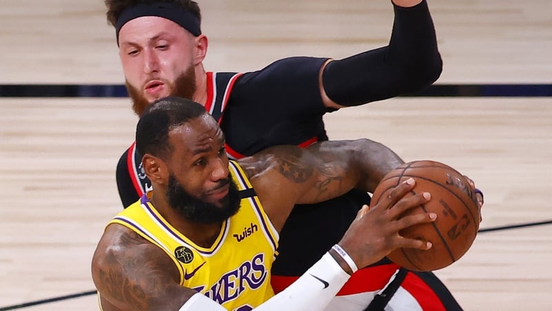 LeBron James drives past Jusuf Nurkic