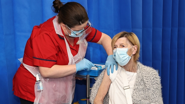 Annie Lynch getting the vaccine in St James's Hospital, Dublin from Deborah Cross