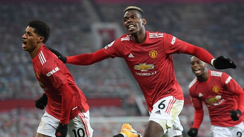 Marcus Rashford wheels away in celebration with Paul Pogba