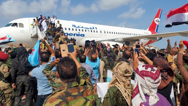 Crowds who had gathered on the airport apron waiting to greet the new government fled, terrified