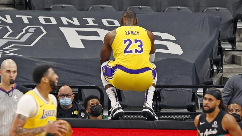 Anthony Davis laughs after LeBron James jumped on the table at the end of second half action at AT&T Center in San Antonio