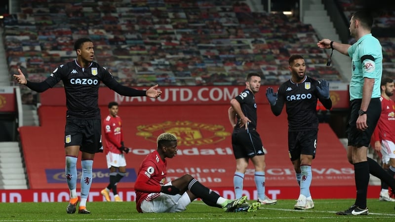 Referee Michael Oliver awards a penalty to Manchester United after Paul Pogba was challenged by Douglas Luiz