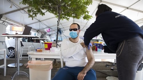 A man receives the Covid-19 vaccine at a drive-thru centre in Haifa, Israel