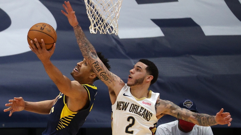 Malcolm Brogdon of the Indiana Pacers evades the New Orleans Pelicans Lonzo Ball