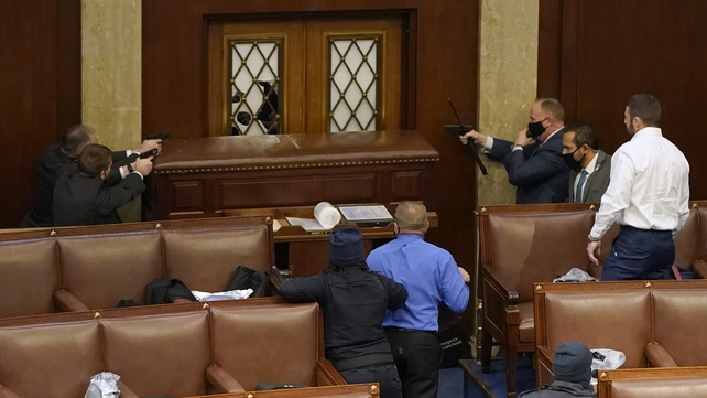 Guns were drawn as protesters tried to storm the House of Representatives chamber