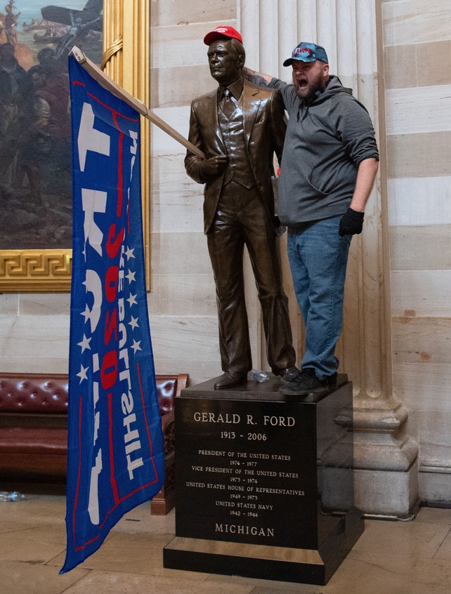 One Trump supporter posed with a Gerald Ford statue