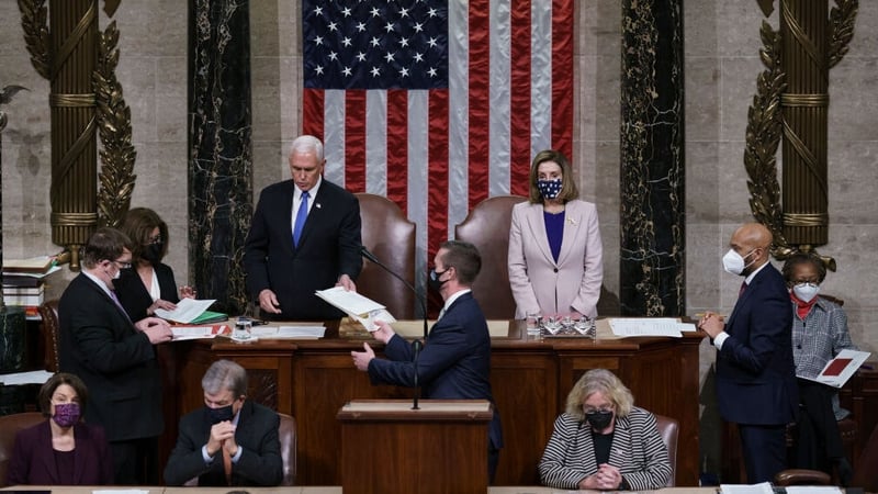 Vice President Mike Pence and House Speaker Nancy Pelosi read the final certification of Electoral College votes