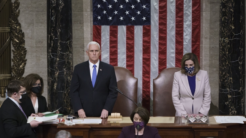 Vice President Mike Pence and Speaker of the House Nancy Pelosi read the final certification of Electoral College votes
