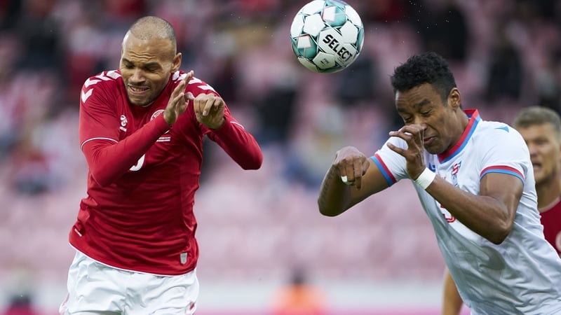 Sonni Ragnar Nattestad beats Denmark's Martin Braithwaite to a header during an international friendly in October
