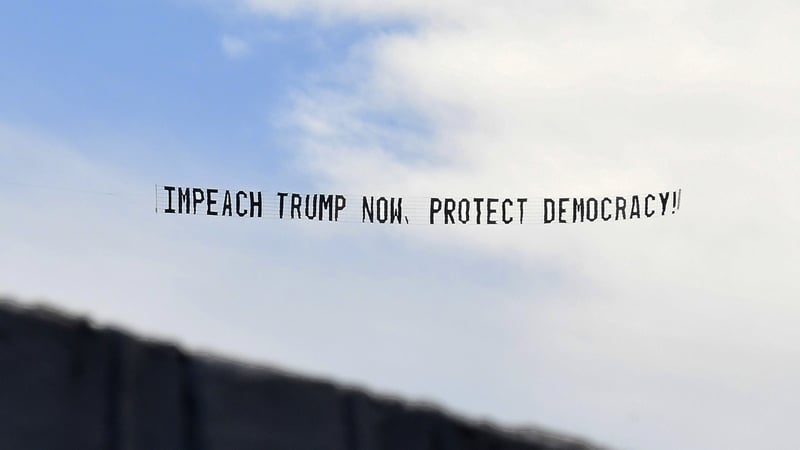 A banner towed by a plane in Florida calling for Donald Trump to be impeached