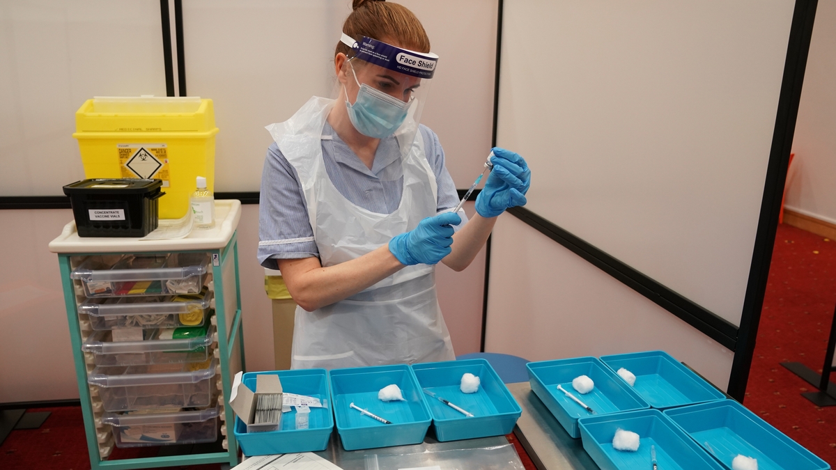 Hospital staff receiving and administering Covid-19 vaccine 