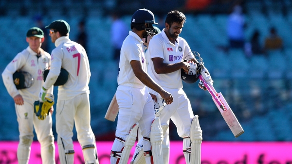 India's Ravichandran Ashwin and Hanuma Vihari walk off the field at the end