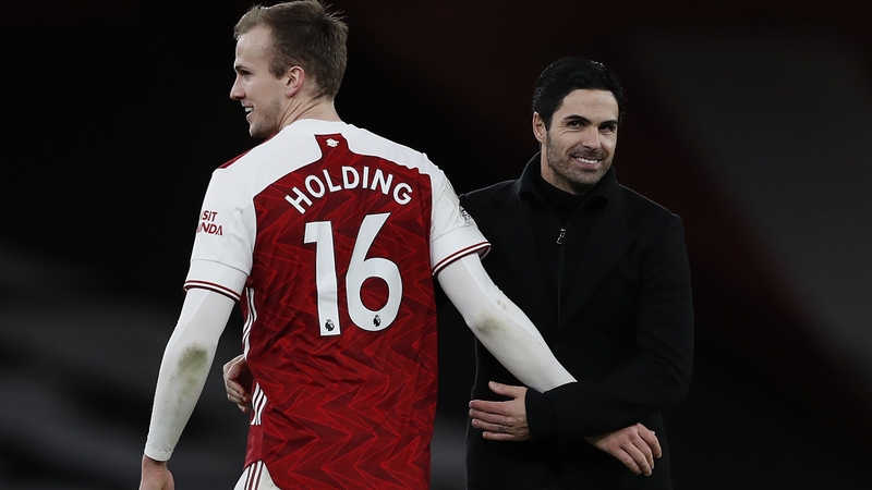Rob Holding (L) and Arsenal manager Mikel Arteta