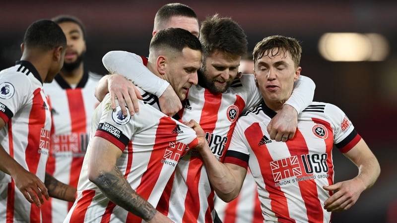 Sheffield United players celebrate Billy Sharp's penalty against Newcastle. It sealed their first Premier League win of the season after 18 games.