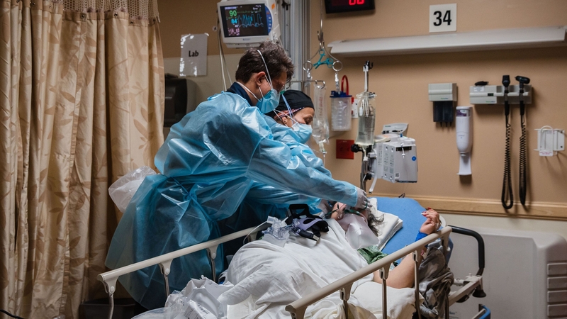 Healthcare workers tend to a Covid-19 patient at Providence St Mary Medical Center in California
