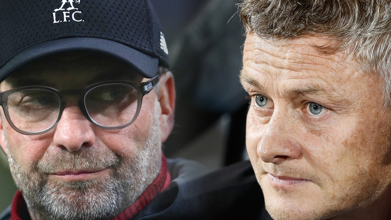 Liverpool's Jurgen Klopp (L) and Manchester United manager Ole Gunnar Solskjaer renew acquaintances on Thursday