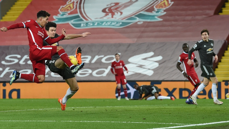 Liverpool's Roberto Firmino is denied a goal scoring opportunity by Man United defender Harry Maguire in the 0-0 draw at Anfield