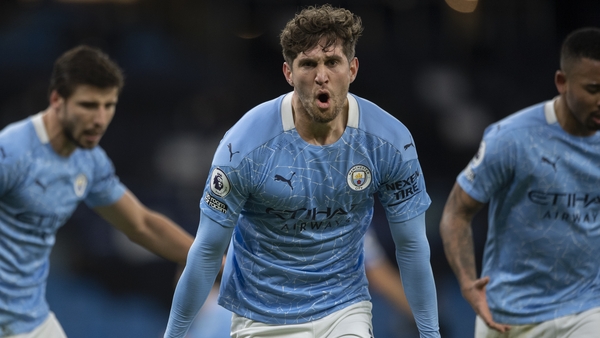 John Stones celebrates scoring the first goal