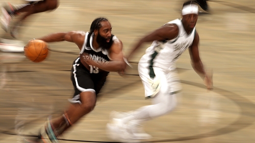 James Harden drives against Jrue Holiday of the Bucks