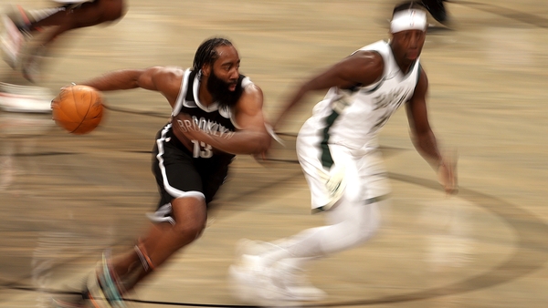 James Harden drives against Jrue Holiday of the Bucks