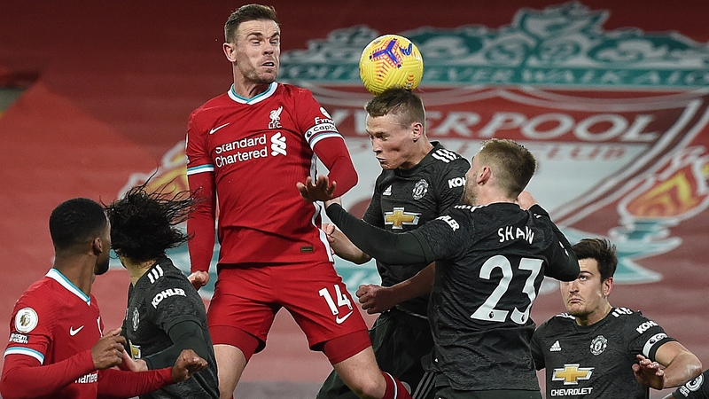 Liverpool captain Jordan Henderson rises to meet a header against Manchester United
