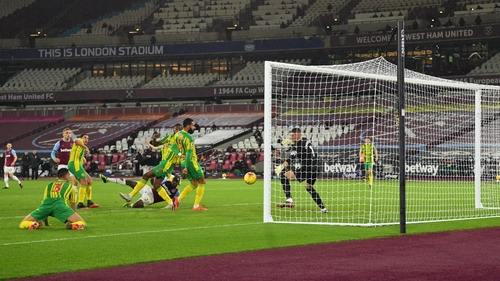 Michail Antonio watches on as his hooked effort beats Sam Johnstone in the West Brom goal
