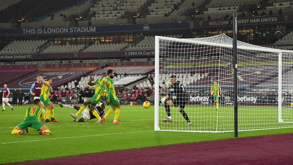 Michail Antonio watches on as his hooked effort beats Sam Johnstone in the West Brom goal