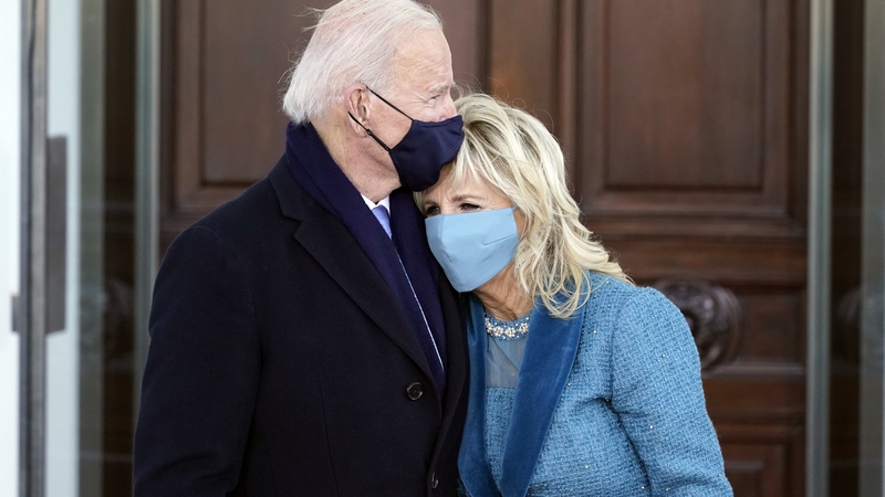 The First Couple embrace on the steps of the White House after a momentous day in Washington DC
