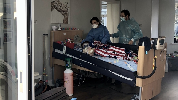 Martin Gibson O'Gara being cared for by his parents in full PPE