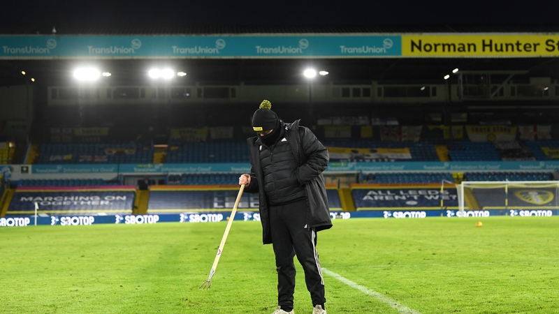 A groundsman tends to the Elland Road surface before Brighton game