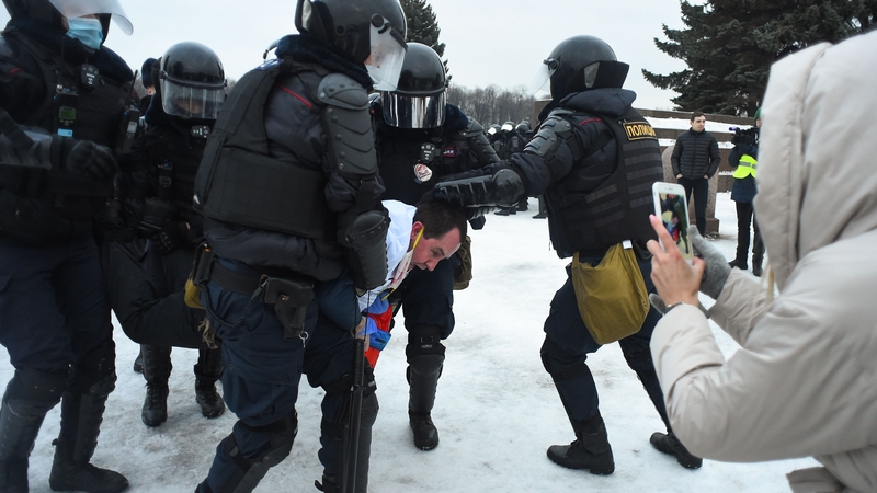 Riot police detain a protester in Saint Petersburg