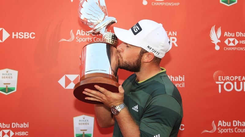Tyrrell Hatton kisses the trophy