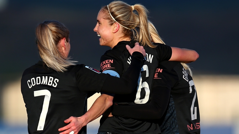 Steph Houghton is mobbed after scoring her second goal