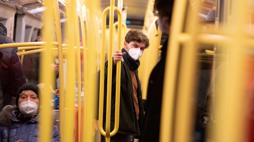 Commuters on an underground train in Vienna are seen wearing FFP2 face masks