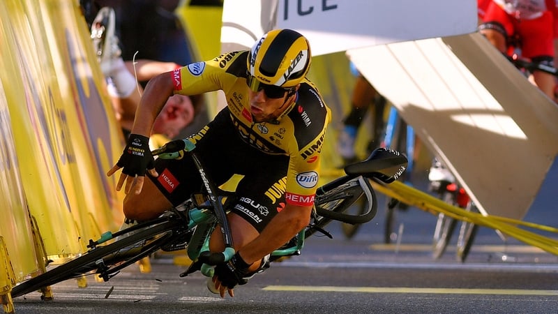Dylan Groenewegen hits the barrier during his crash in the Tour of Poland