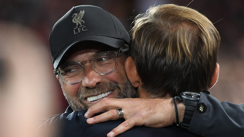 Jurgen Klopp (L) embracing Tuchel during a 2018 Champions League game against PSG