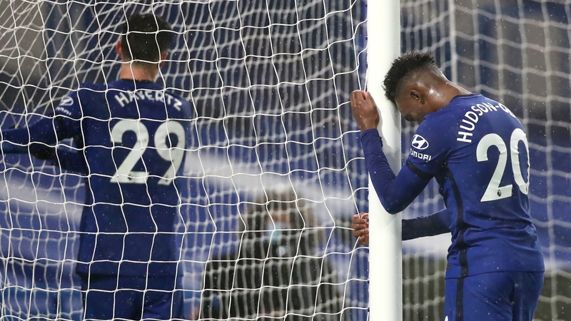 Callum Hudson Odoi leans on the goal post in frustration after a missed chance