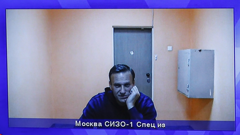 Alexei Navalny is shown on a monitor screen during the hearing at Moscow Region Court in Krasnogorsk outside Moscow