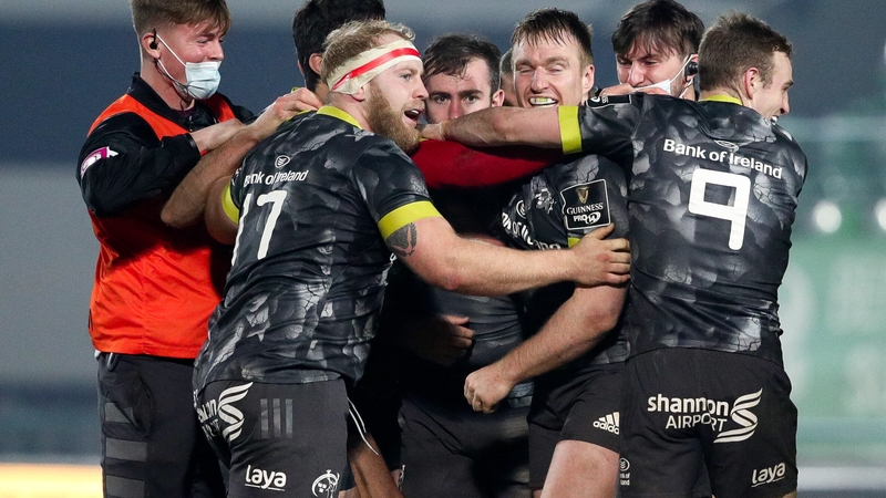 JJ Hanrahan of Munster is congratulated by his team-mates