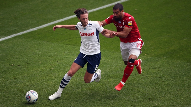 Preston North End's Ben Davies (L) holds off Nottingham Forest's Lewis Grabban in a Championship match last year