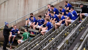 The open university. The Cavan players, keen students of the game, listen to a lecture from manager Mickey Graham at half-time.