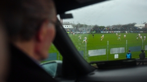 The view from the carwash. There's no point getting drenched when you have a 300-mile drive home to Annascaul in the Dingle Peninsula so Patrick Evans and his grandson Shane watch the match in Edendork from the comfort of their car.