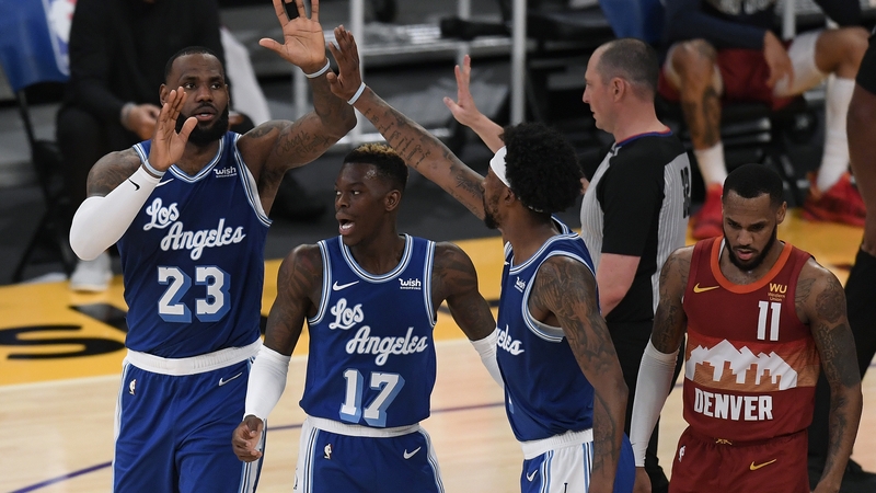 LeBron James celebrates with Dennis Schroder and Kentavious Caldwell-Pope