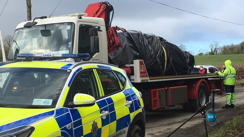 The burnt-out car was removed from the scene this afternoon